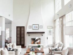 Living Room With High Ceiling And Fireplace